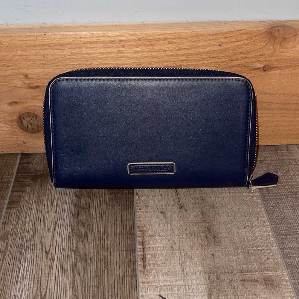 Vera Bradley navy blue and cream piping wallet. Sizing: 8”W x 5”H x opening 5”.